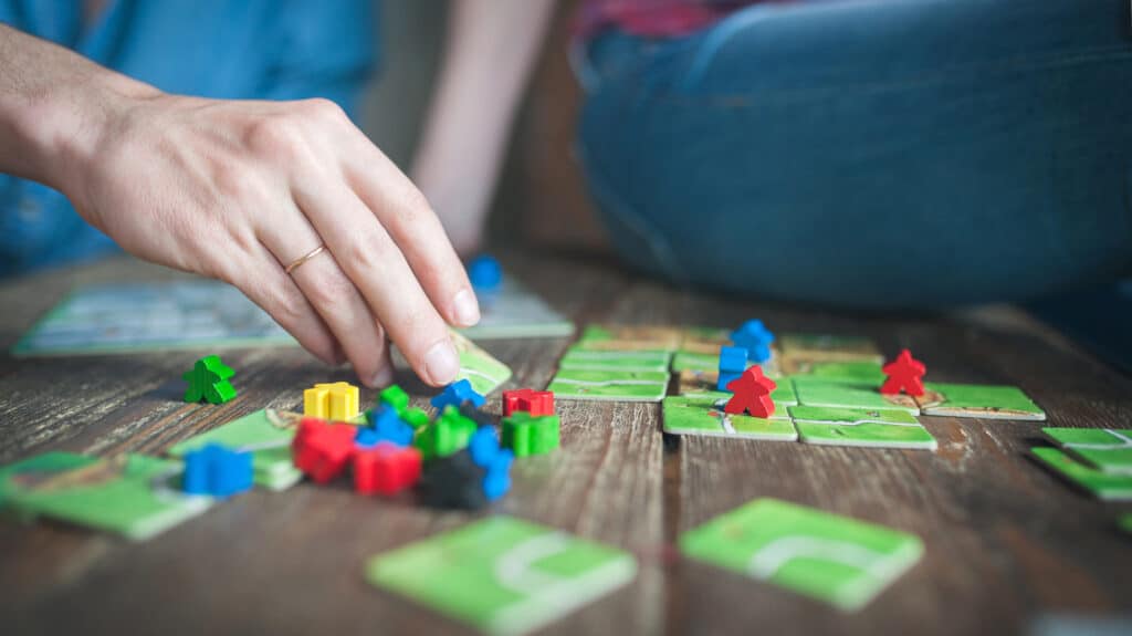 Hands Playing Board Games